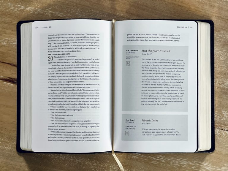 an open book sitting on top of a wooden table