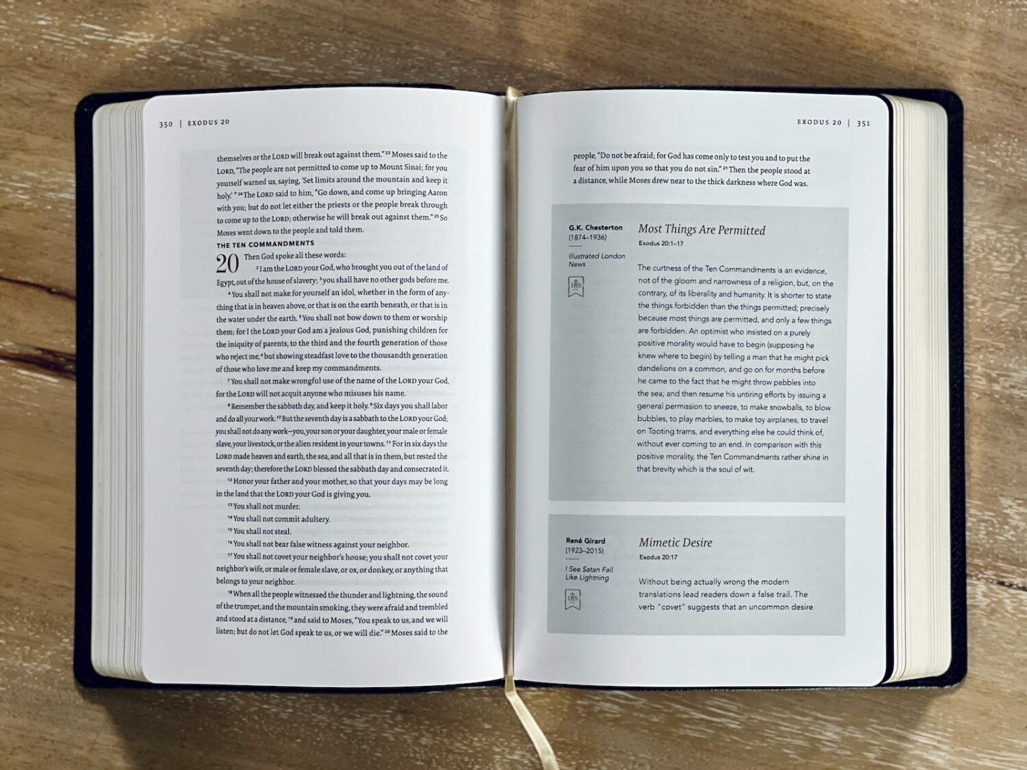 an open book sitting on top of a wooden table