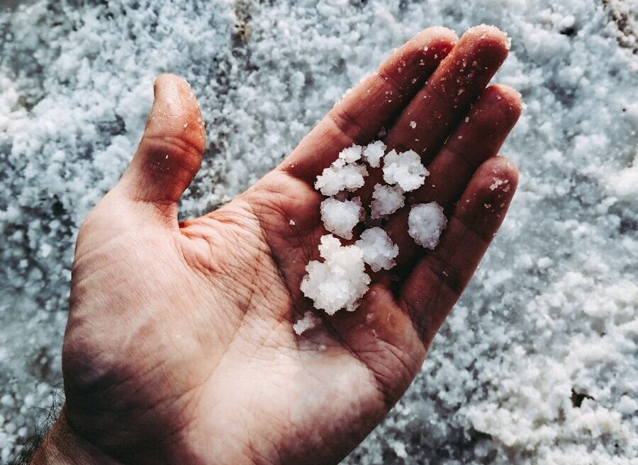 white stones on persons hand