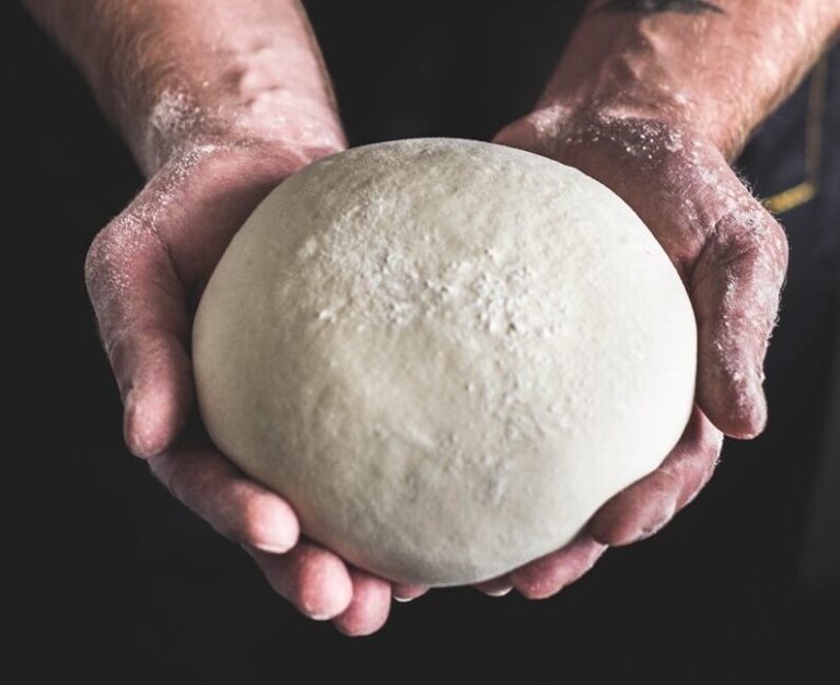 person holding dough